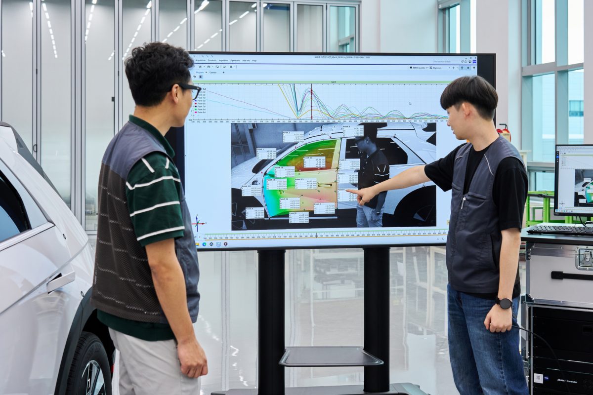 Engineers review dynamic motion validation results.
